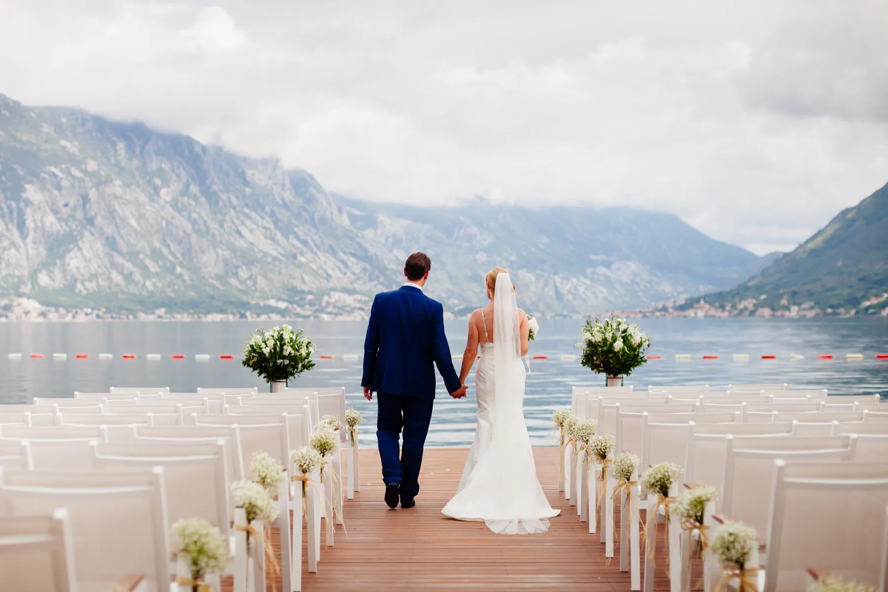 Newlyweds overlooking a mountain landscape